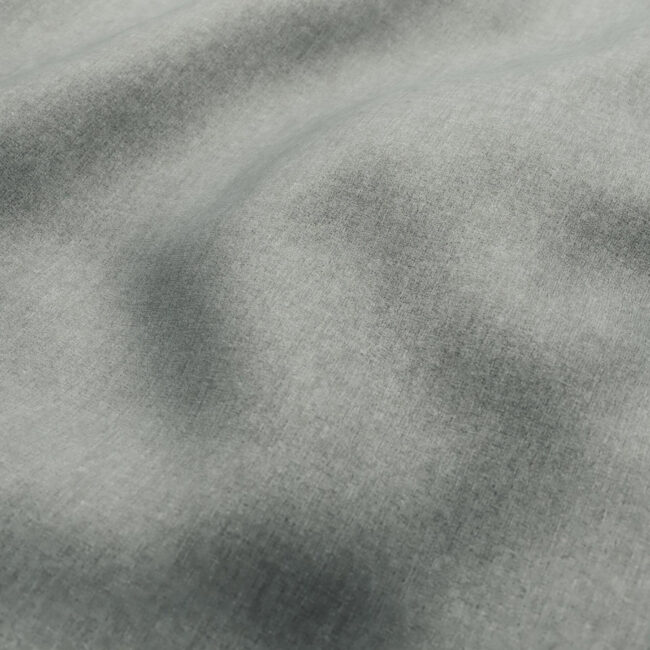 Gray fabric texture background of dark grey colored shirt. Cloth